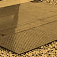 Hydraulic liftgate — ridged platform with a fold hinge and yellow warning edge